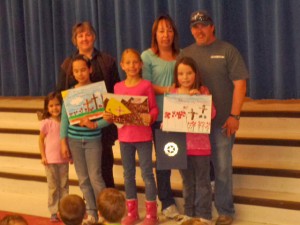 From L to R with their posters are: Kailey McCraw, Cambria Stoops & Aloria Durham, with family members.